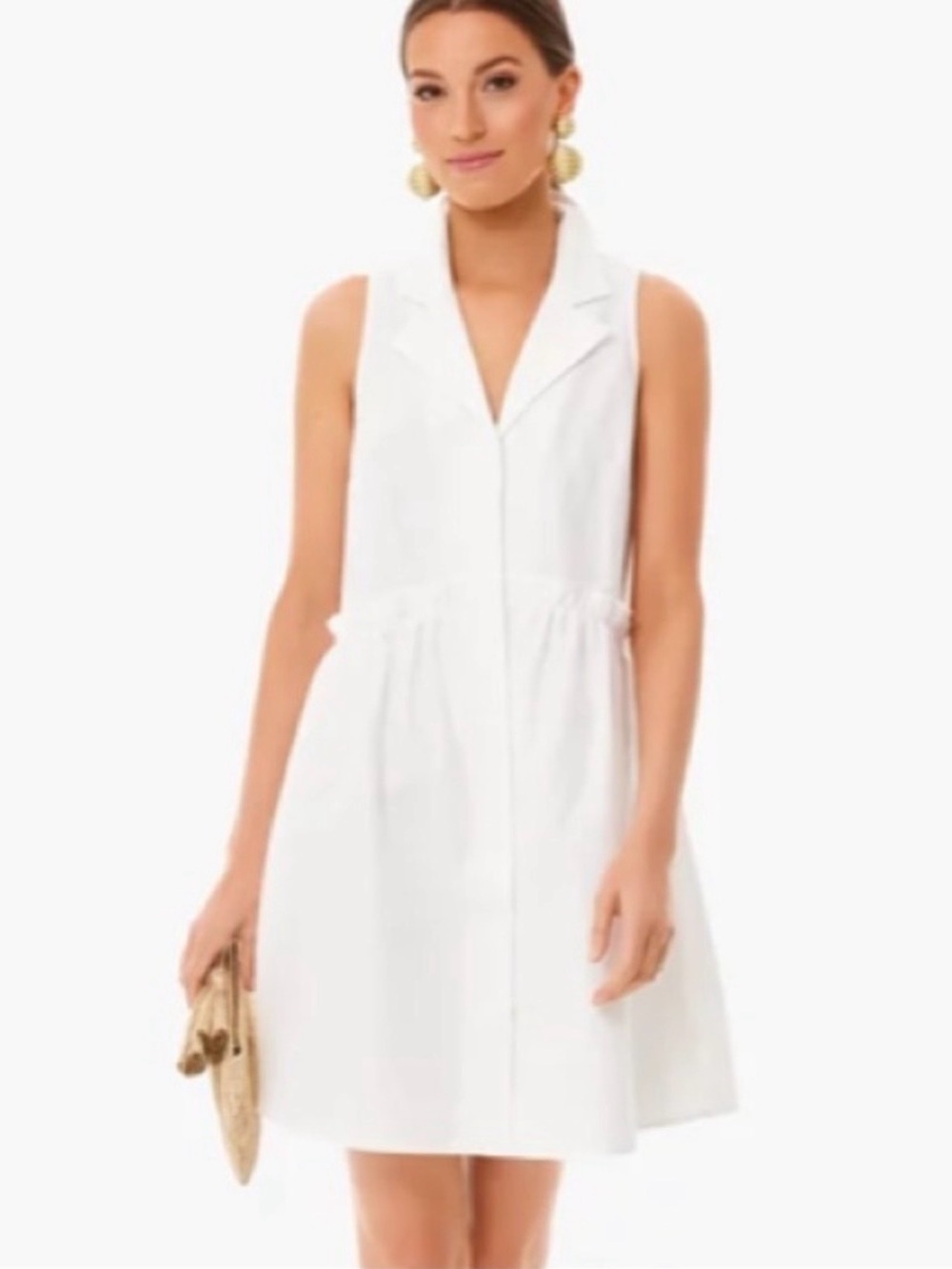The Oxford White Sleeveless Royal Shirt Dress features a drop waist, notched col